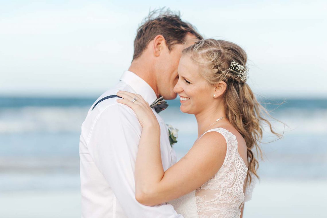 mooloolaba-surf-club-wedding-bride-and-groom-on-beach